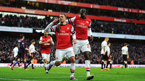 podolski e chamberlain portano wenger ai quarti di fa cup