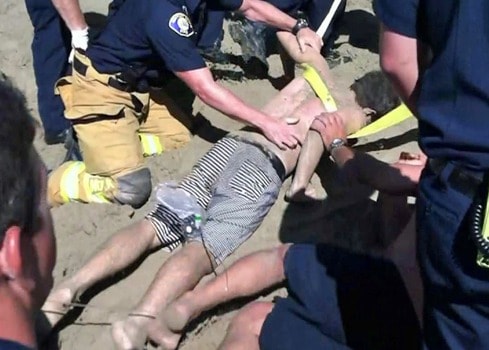 Teen-survives-buried-alive-beach-30-MINUTES-tunnel-built-sand-caved-in.html