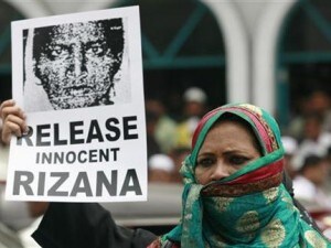 Demonstrator holds image of Nafeek, jailed in Saudi Arabia on charges of murder, during protest demanding her release in Colombo