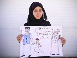 Una bambina siriana regge un cartello contro i matrimoni precoci dove si legge: "Papà, dove mi sta portando? Andiamo al parco?". (Foto Rosie Thompson/Save the Children)
