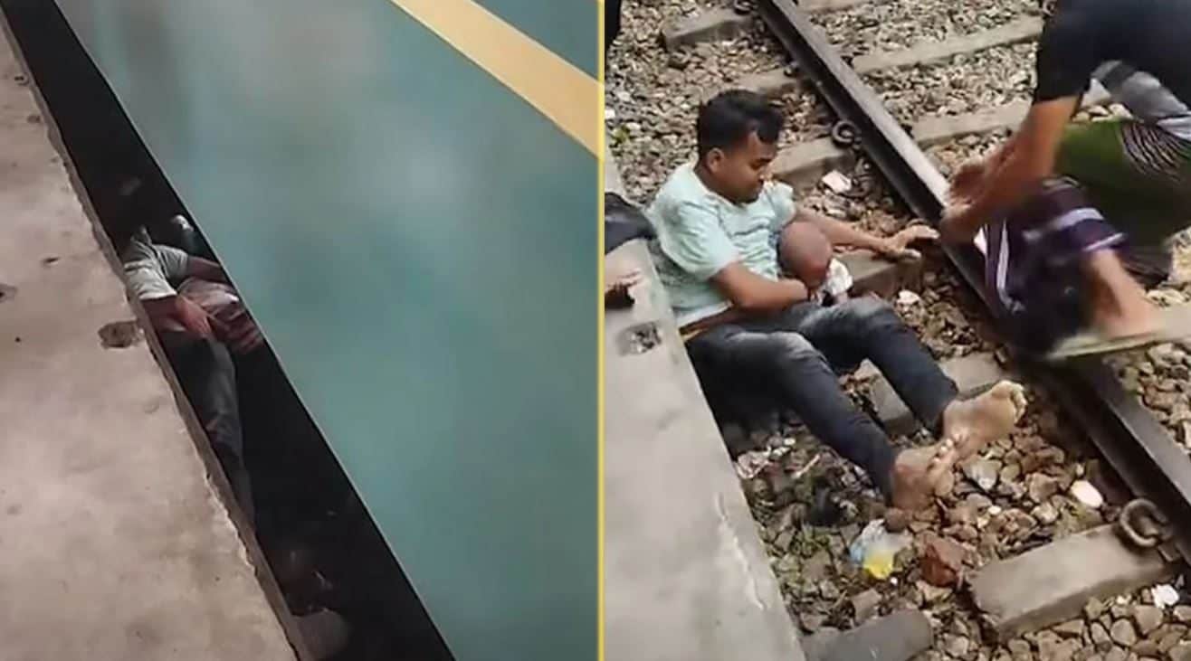 Bimbo di 2 anni cade sui binari, padre lo copre col corpo e lo salva dal treno che passa su di loro: il video dal Bangladesh