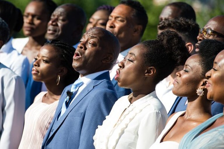 LONDON, ENGLAND - JULY 24: The Kingdom Choir perform outside Kensington Palace on July 24, 2018 in London, England. The choir, which performed at the Royal Wedding of Prince Harry to Ms. Meghan Markle, announced that they have signed a record deal with Sony Music. (Photo by Jeff Spicer/Getty Images)