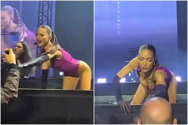 Elodie allontana due fotografi che si avvicinano troppo al palco, il gesto della cantante durante il concerto