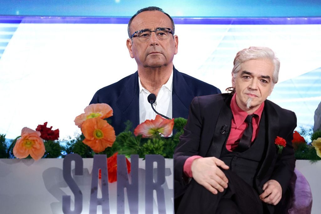 Carlo Conti su invito a Morgan a Sanremo 2026: "Non sono un giudice, finché non lo condannano è legittimo averlo"