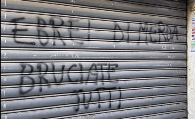 La scritta nel quartiere Marconi.