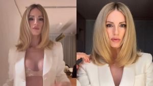 Michelle Hunziker in bianco alla festa di Natale: sotto la giacca il reggiseno scintillante